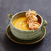 Cream of sweet potato soup with a mini shrimp brochette