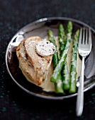 Sliced chicken breast with truffle butter
