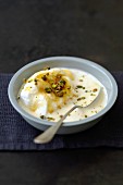 Beaten egg whites in cream with pistachios