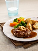Beef burger with onion sauce,steamed vegetables and sauteed potatoes