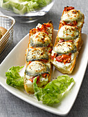 Tomato and goat's cheese grilled on baguette bread
