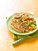 Pork chop with mirabelle plum and vegetables