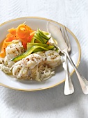 Monkfish with steamed vegetable strips,creamy onion sauce