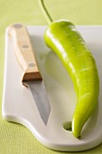 Green pepper on a chopping board