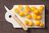 Kumquats on a chopping board