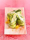Stuffed cucumber strips with cheese and pistachios