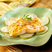 Piece of salmon with saffron and lime