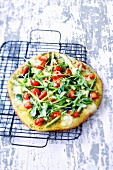 White pizza with green asparagus and cherry tomatoes
