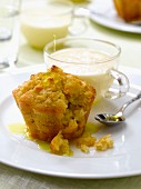 Small apple cake with saffron syrup and custard