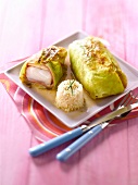 Pieces of cod wrapped in cabbage leaves
