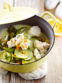 White fish,green vegetable and orange casserole