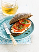 Cottage cheese, tomato and chive rye bread sandwich