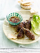 Lamb keftas with spicy sauce
