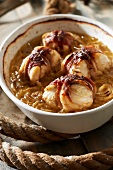 Monkfish and bacon Paupiettes in onion and Breton cider sauce