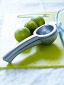 Limes and lime squeezer with a handle