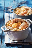 Individual seafood and white haricot bean casseroles