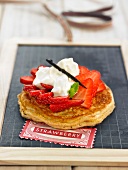 Thick pancake with strawberries and cream
