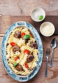 Pasta with beef meatballs and sesame seeds
