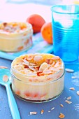 Individual apricot and thinly sliced almond batter puddings