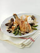 Bresse poulard hen in creamy yellow wine sauce, morels and asparagus