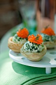 Artichoke bases garnished with mascarpone, alfafa,trout roe and chives