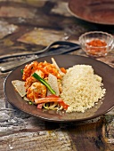 Semolina and sauteed chicken and vegetables