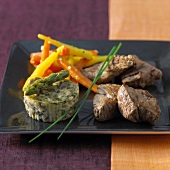 Fillet of beef with carrot duo and small asparagus flan