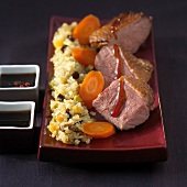Duck magret with honey sauce,quinoa with raisins and carrots