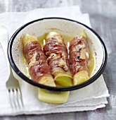 Leeks wrapped in raw ham and grilled with Fromage frais