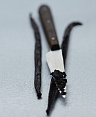 Removing the seeds from the vanilla pod with the end of the knife