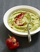 Cream of avocado with red hot pepper