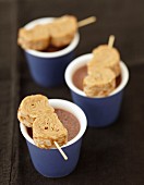 Milk jam rolled crepe brochettes and cups of hot chocolate