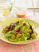 Green and red lettuce, mushroom and olive salad