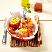 Coodle eggs baked in tomatoes