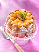 Almond-flavored and syrupy apricot Charlotte