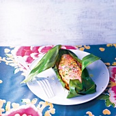 Emperor red snapper cooked in a banana leaf