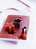Cutting quince stars with a star-shaped biscuit cutter