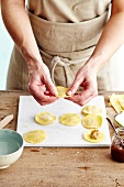 Closing the raviolis and tightning the edges