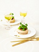 Foie gras on toast garnished with stewed onions and corn lettuce