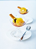 Orange fruit salad with star anise syrup and gingerbread fingers