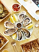 Tray of oysters with tasting sauces