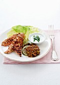 Thinly sliced marinated chicken, grilled slices of lime, veal patties and creamy mint sauce