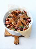 Roasted chicken in Crapaudine,with thyme,rosemary,Grenailles potatoes and shallots