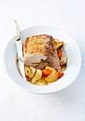 Roast pork stuffed with herbs,onions,carrots and fennel