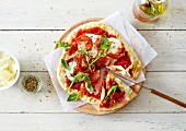 Sun-dried tomato,mozzarella and raw ham pizza