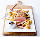 Medium-cooked turkey breast with spicies and pears