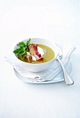Creamed 7 vegetable soup with crisp bacon and cream