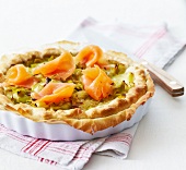 Leek quiche garnished with smoked salmon