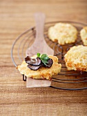 Small röstis garnished with thinly sliced truffles