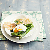 Green asparagus with a soft-boiled egg and parmesan tuiles